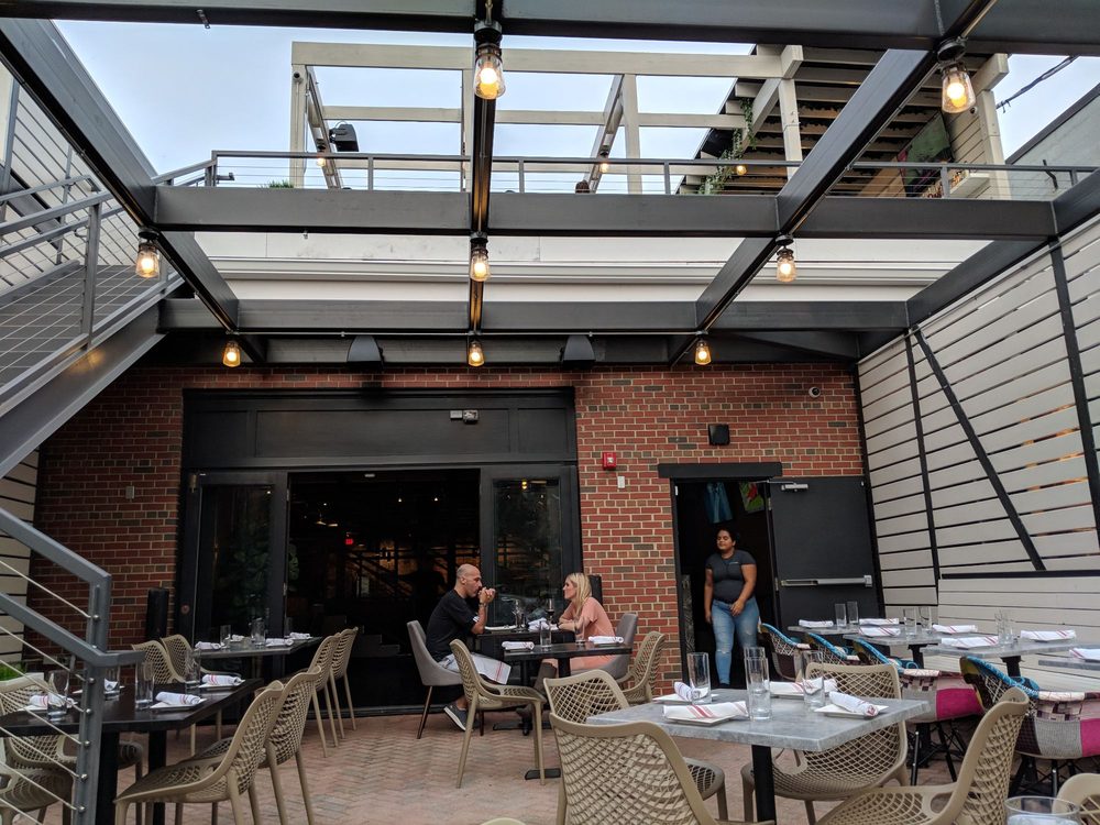 Rooftop patio dining area at Wilson Hardware Kitchen & Bar in Clarendon, VA.